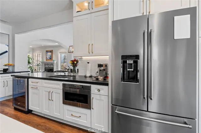 a bathroom with a tub and a large window