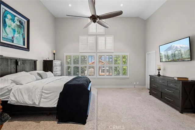 a bathroom with a granite countertop sink a mirror and shower