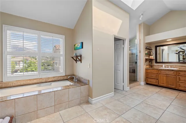 a view of a hallway with wooden floor and closet