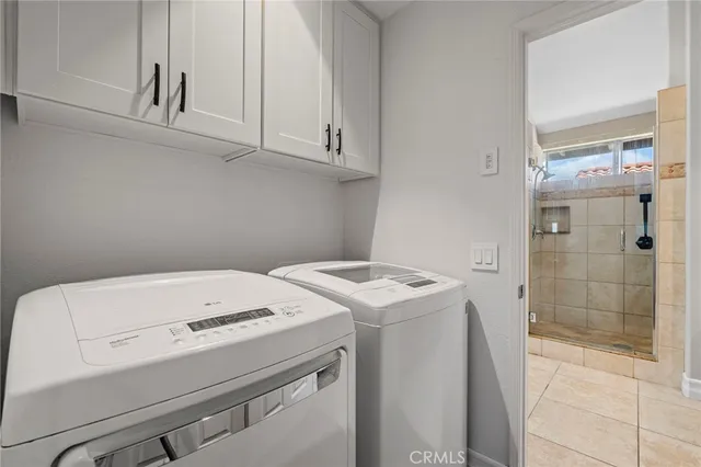 a bathroom with a granite countertop sink double vanity and a mirror