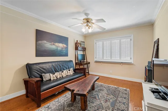 a living room with furniture or couch and a bookshelf