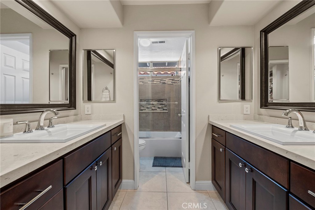 3 Snowdon Rancho Santa Margarita, CA 92679 - Photo 31 of 69 a bathroom with a granite countertop sink double vanity and a mirror