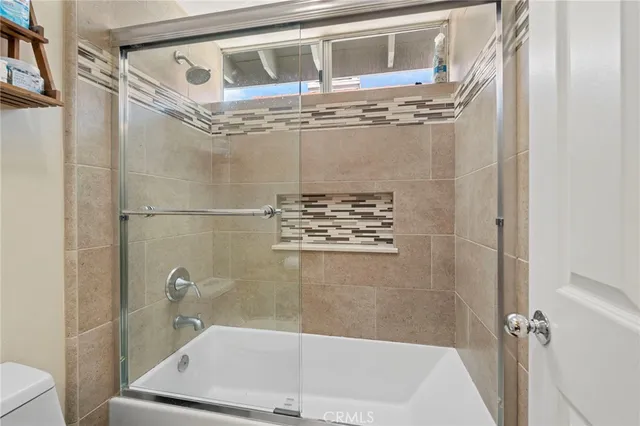 a living room with furniture a rug and a fireplace