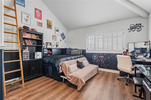 a view of washer and dryer with kitchen in the background
