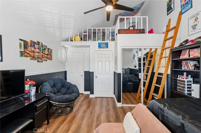 a view of a patio with table and chairs with wooden floor and fence