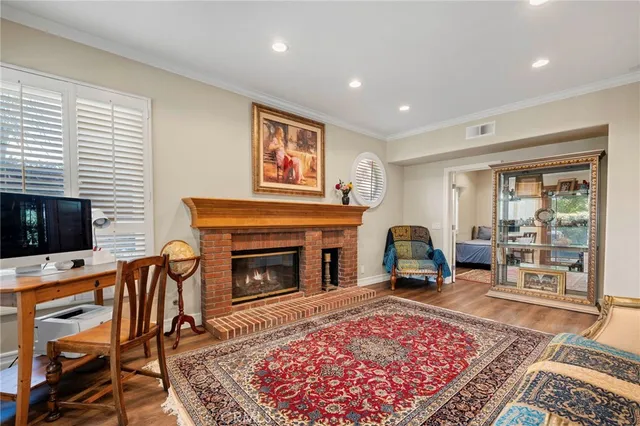 a view of a house with swimming pool and sitting area