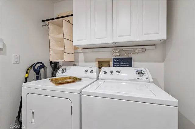 an aerial view of a house with a yard and outdoor seating