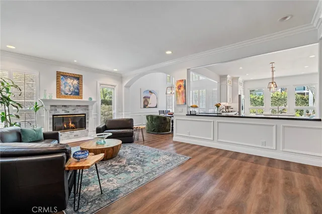 a kitchen with kitchen island granite countertop a sink counter top space and stainless steel appliances