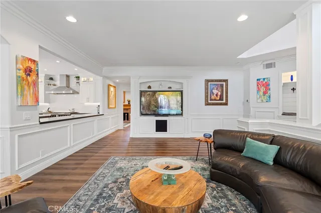 a kitchen with a table chairs stove and cabinets