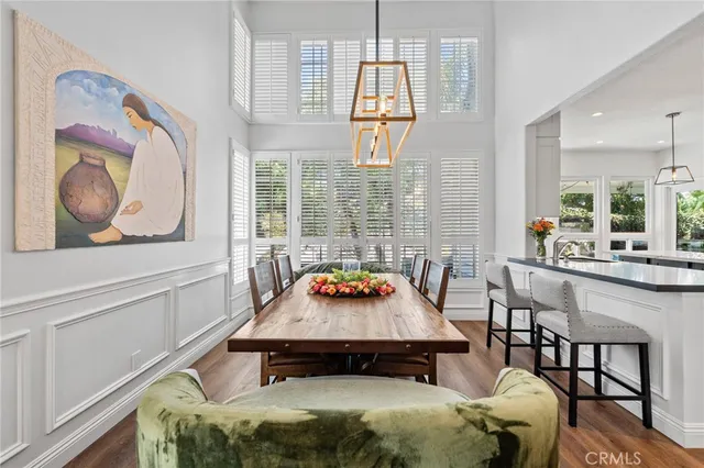 a kitchen with stainless steel appliances granite countertop a sink and a refrigerator