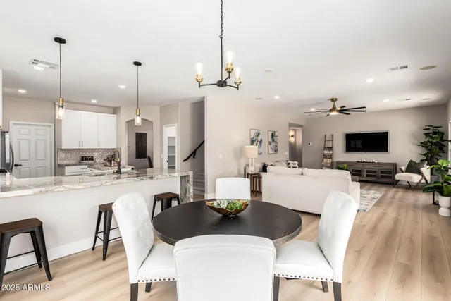 a view of a dining room with furniture window and outside view