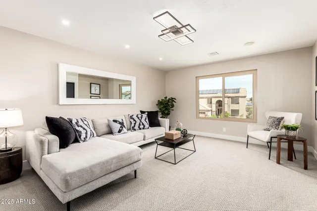 a view of an empty room with a ceiling fan