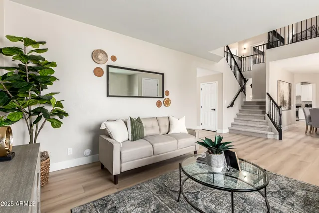 a living room with furniture or couch and a wooden floor
