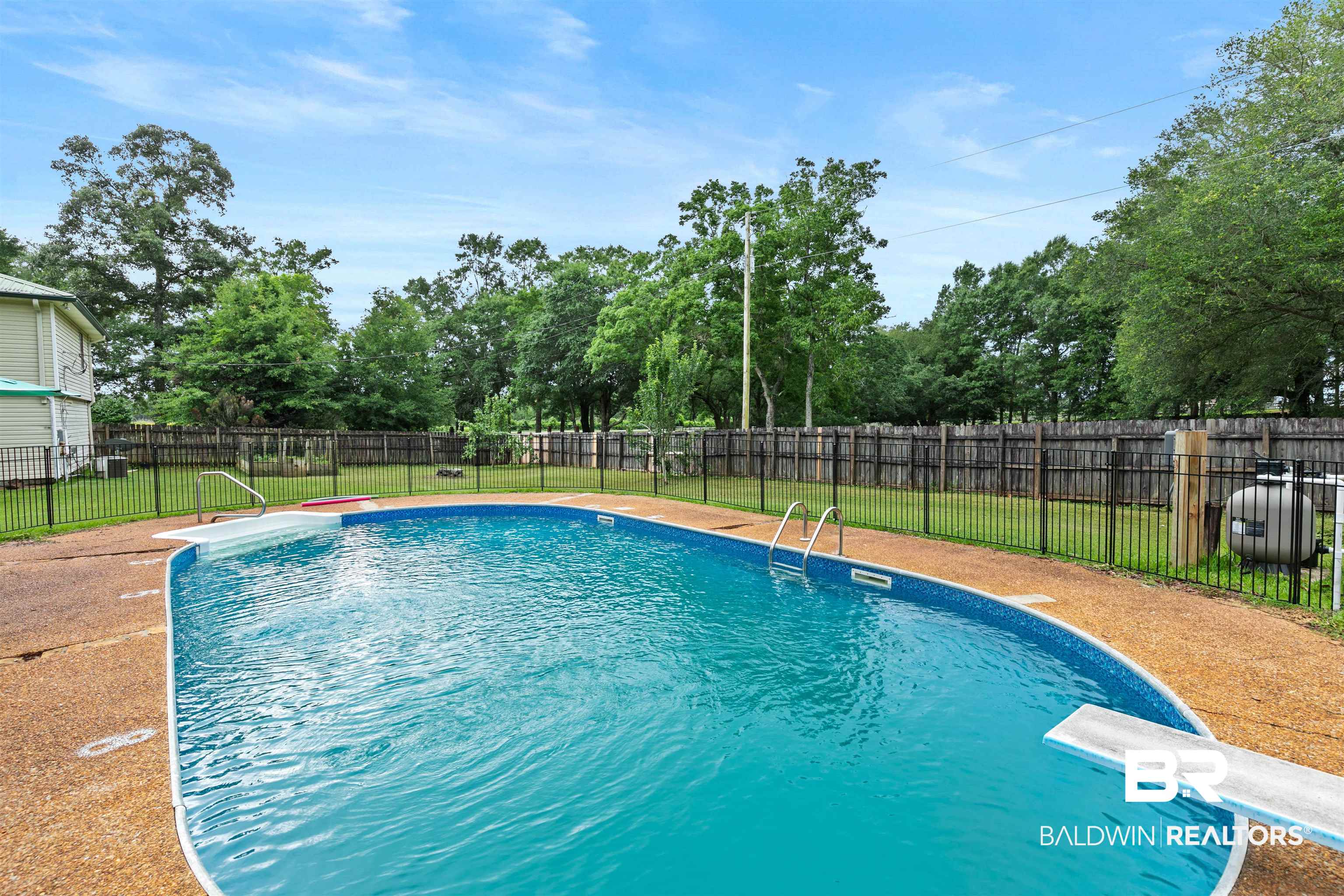 10420 Johnson Road South Mobile, AL 36695 - Photo 60 of 75 In-ground swimming pool with diving board and integrated steps