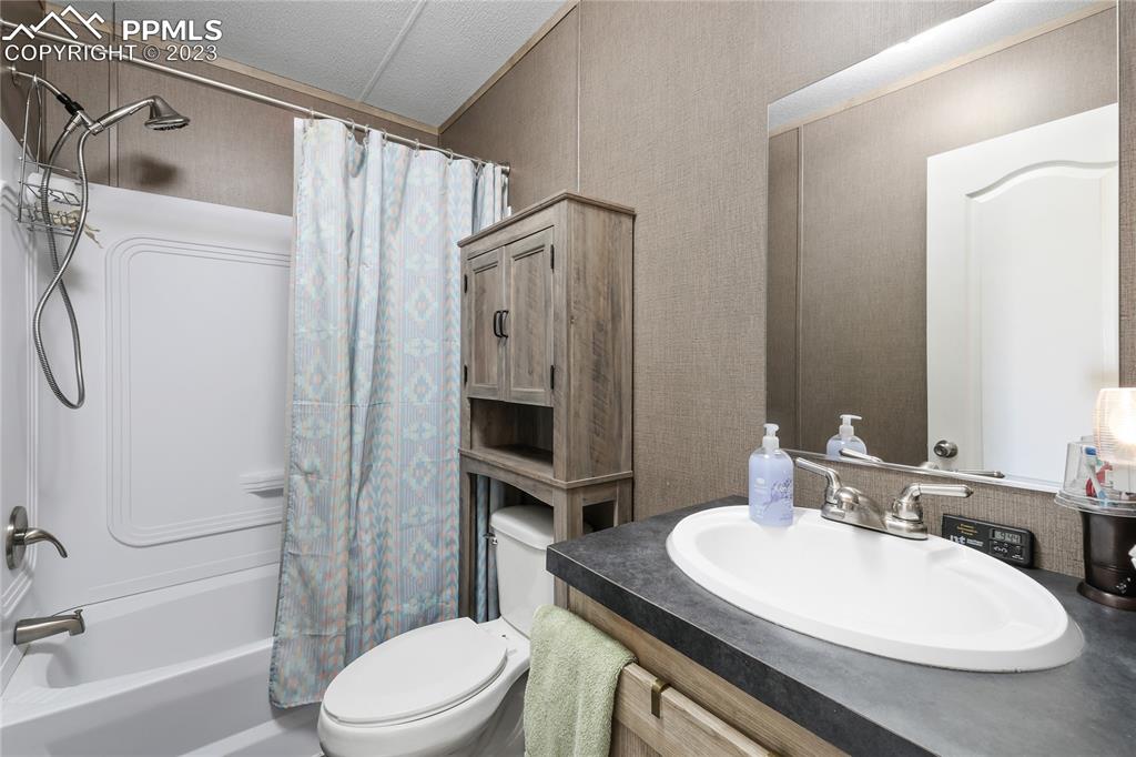 10845 Berridge Road Calhan, CO 80808 - Photo 15 of 32 a bathroom with a sink toilet and shower