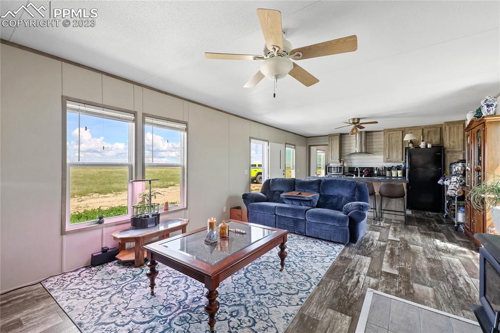 10845 Berridge Road Calhan, CO 80808 - Photo 2 of 32 a living room with furniture and a window
