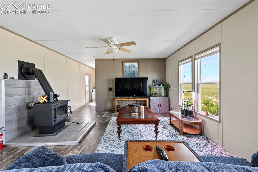 10845 Berridge Road Calhan, CO 80808 - Photo 4 of 32 a living room with furniture and a flat screen tv