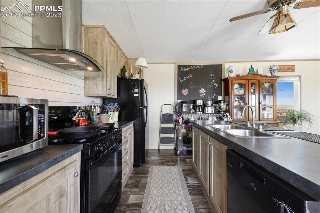 10845 Berridge Road Calhan, CO 80808 - Photo 5 of 32 a kitchen with lots of counter top space