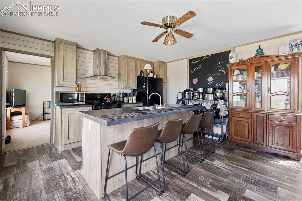 10845 Berridge Road Calhan, CO 80808 - Photo 7 of 32 a view of living room kitchen and entryway
