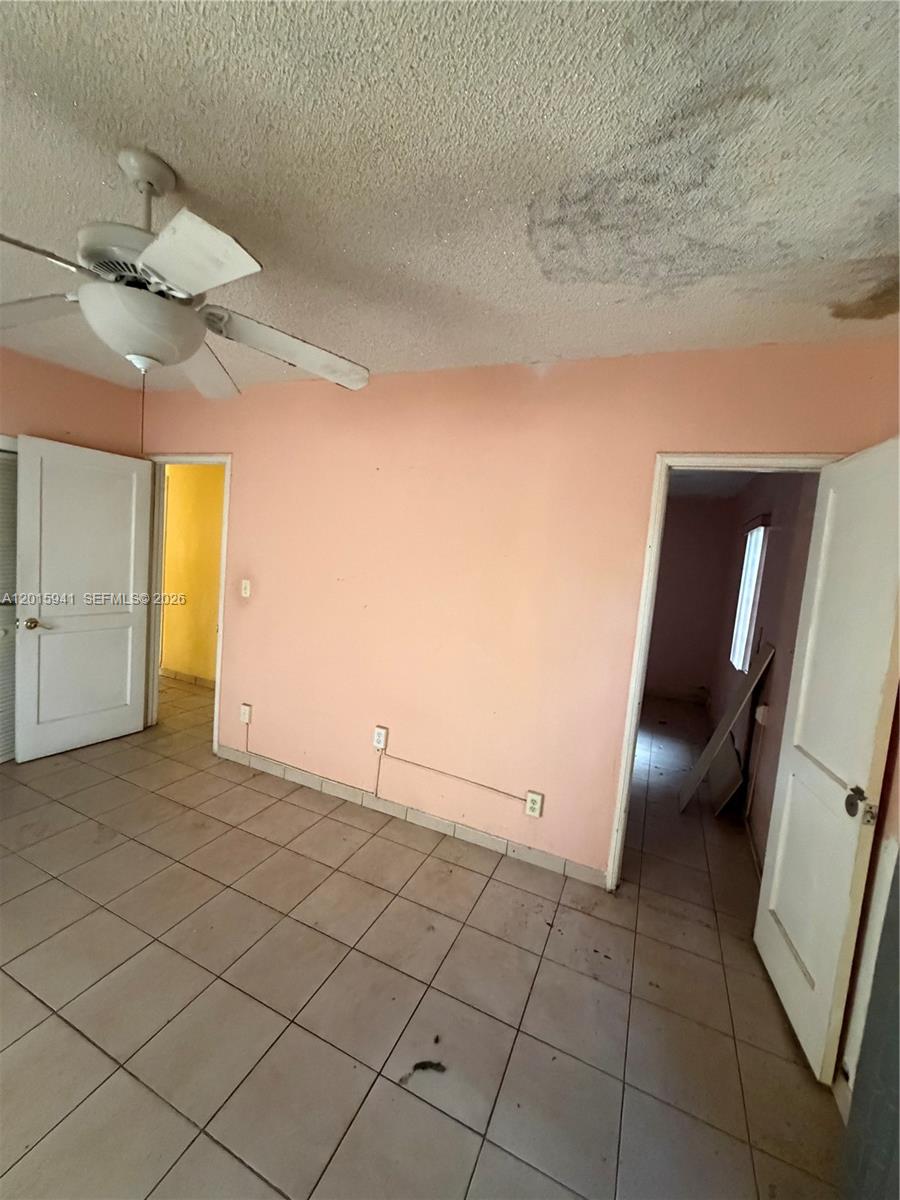 841 Northeast 4th Place Hialeah, FL 33010 - Photo 2 of 6 a view of an empty room
