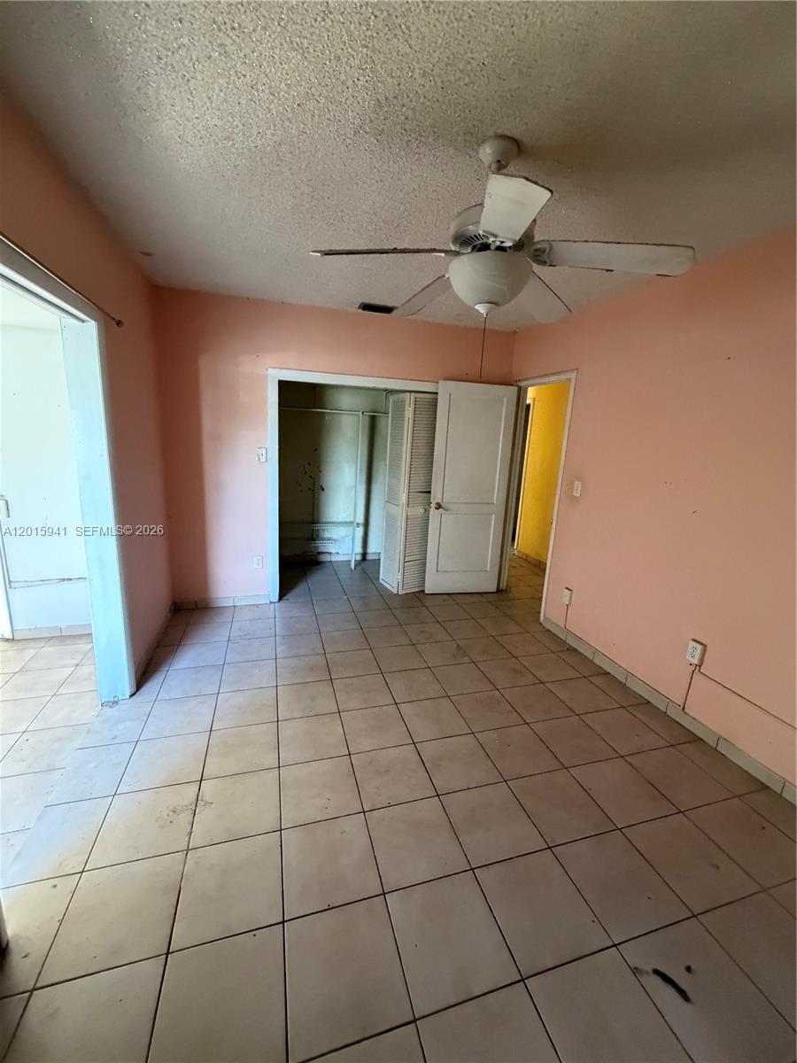 841 Northeast 4th Place Hialeah, FL 33010 - Photo 5 of 6 a view of an empty room with a window
