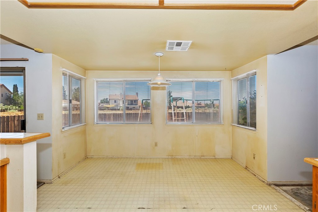 15620 Smoke Tree Street Hesperia, CA 92345 - Photo 14 of 34 a view of empty room with wooden floor and window