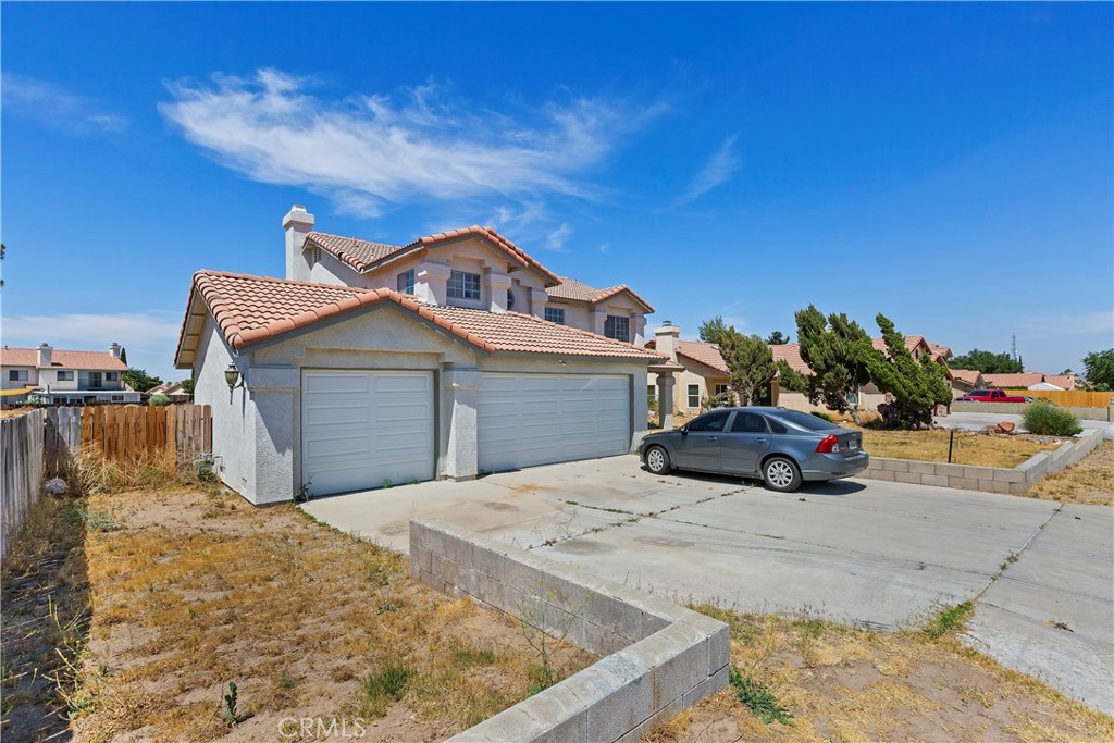 15620 Smoke Tree Street Hesperia, CA 92345 - Photo 2 of 34 a front view of a house with a yard