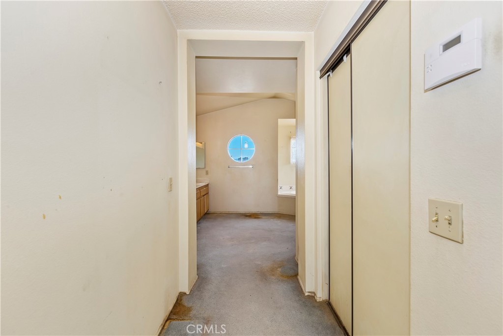 15620 Smoke Tree Street Hesperia, CA 92345 - Photo 25 of 34 a view of a livingroom with a door