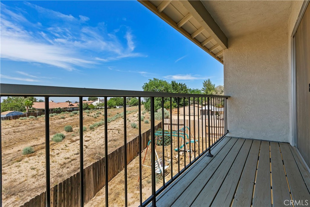 15620 Smoke Tree Street Hesperia, CA 92345 - Photo 29 of 34 a view of balcony with wooden floor