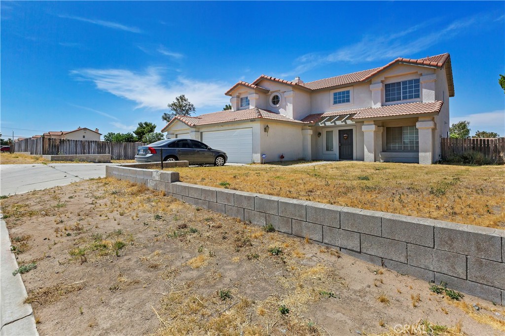15620 Smoke Tree Street Hesperia, CA 92345 - Photo 3 of 34 a view of a house with a snow in the background