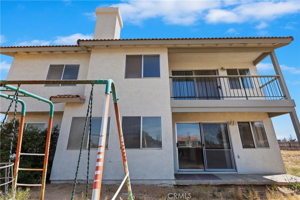 15620 Smoke Tree Street Hesperia, CA 92345 - Photo 31 of 34 front view of a house with a balcony