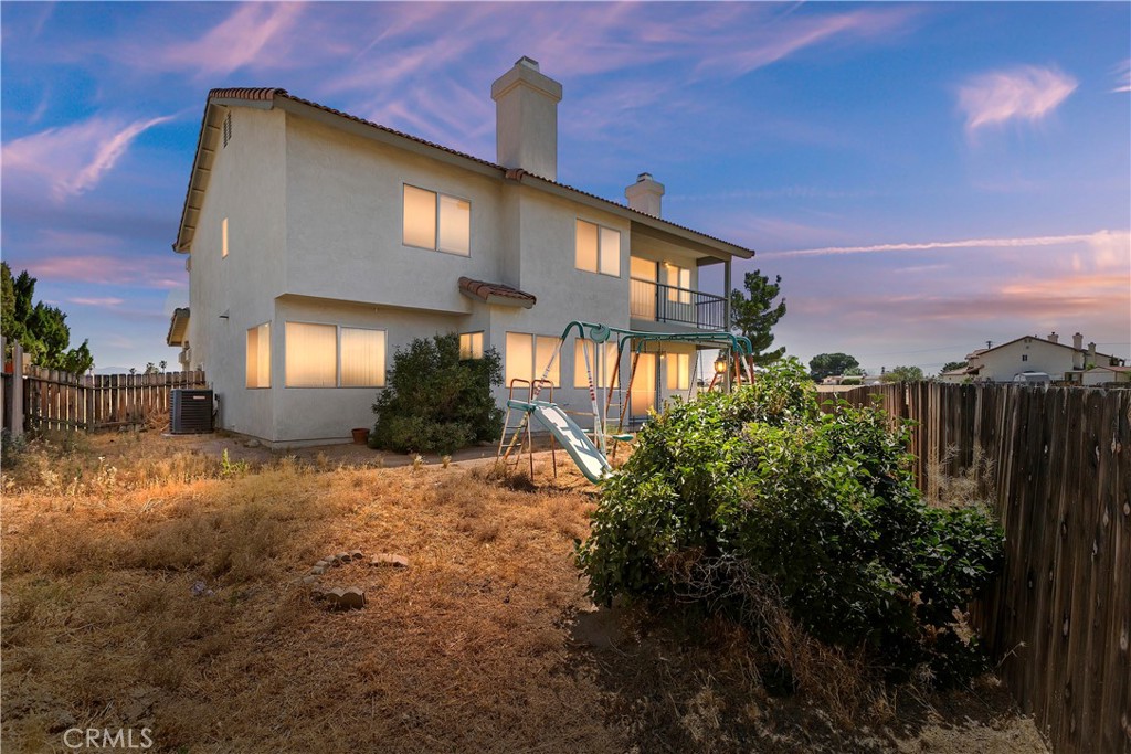15620 Smoke Tree Street Hesperia, CA 92345 - Photo 34 of 34 a front view of a house with a yard and tree s