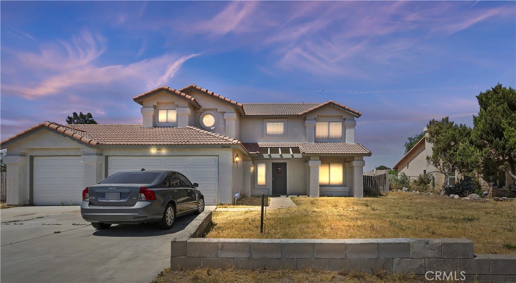 15620 Smoke Tree Street Hesperia, CA 92345 - Photo 4 of 34 a front view of a house with parking space