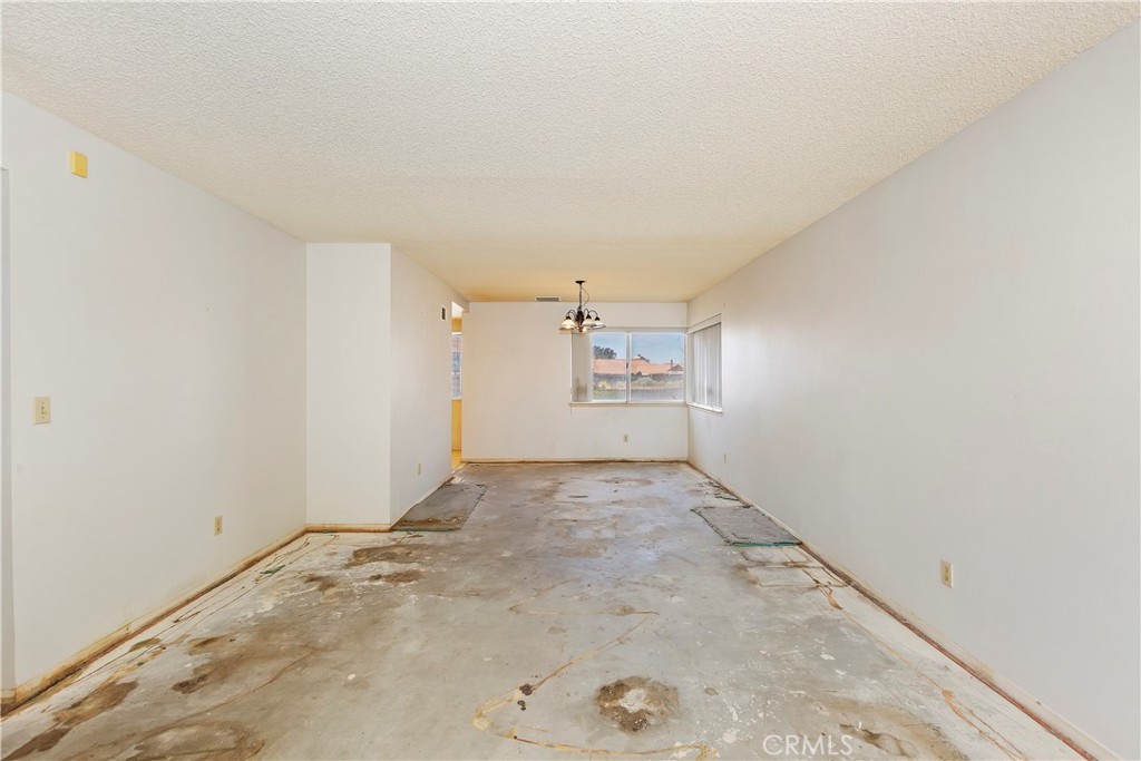 15620 Smoke Tree Street Hesperia, CA 92345 - Photo 7 of 34 an empty room with shelves