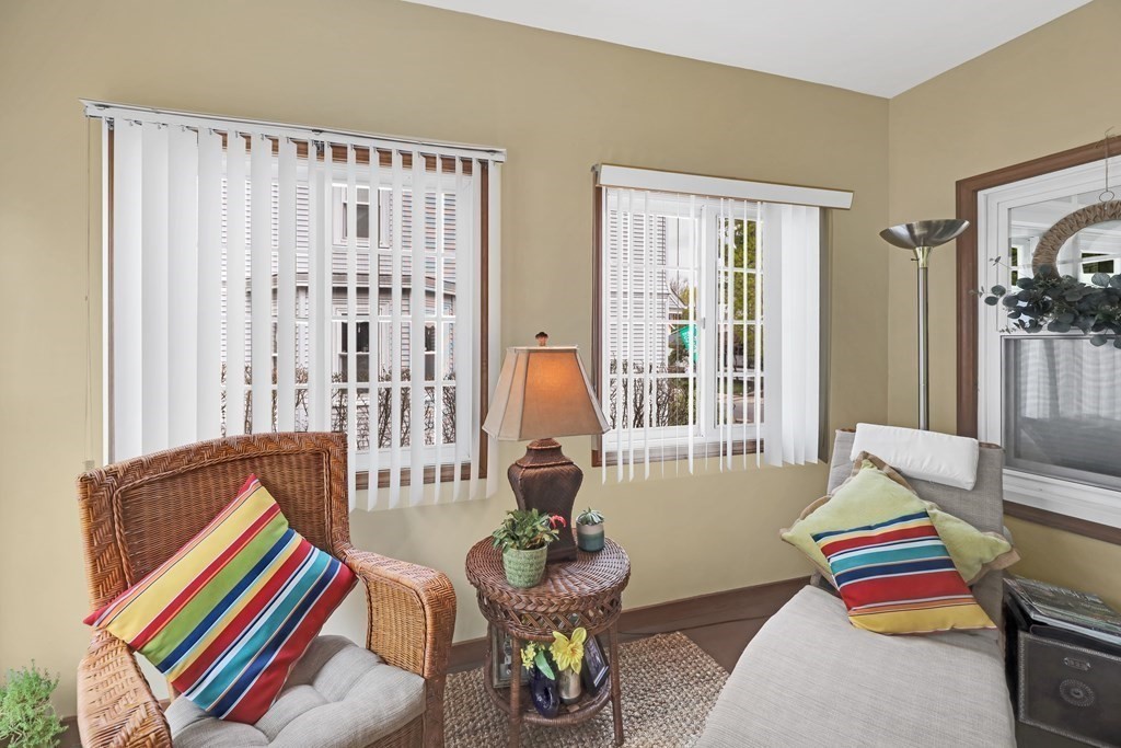 192 Maple Street Boston, MA 02132 - Photo 13 of 24 a living room filled with furniture and floor to ceiling windows