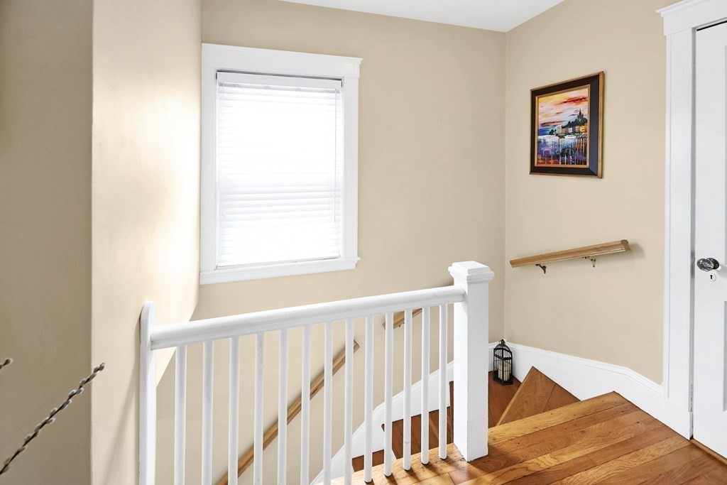 192 Maple Street Boston, MA 02132 - Photo 14 of 24 a view of a hallway with wooden floor and entryway
