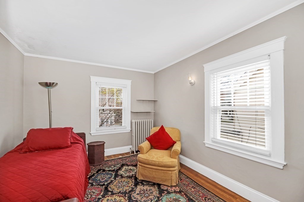 192 Maple Street Boston, MA 02132 - Photo 19 of 24 a living room with furniture and a window
