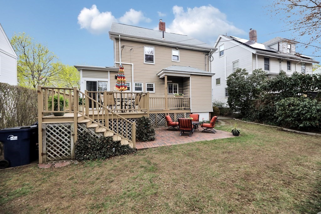 192 Maple Street Boston, MA 02132 - Photo 20 of 24 a view of a house with patio furniture and garden
