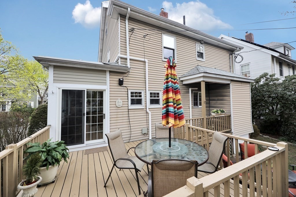 192 Maple Street Boston, MA 02132 - Photo 2 of 24 a view of house with a porch and furniture