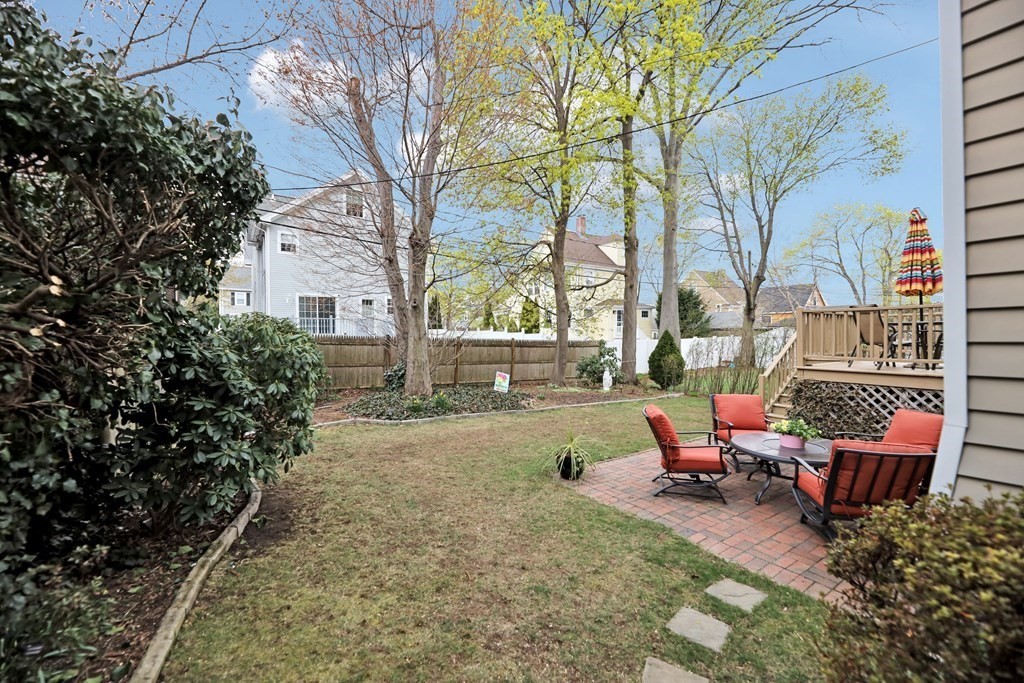 192 Maple Street Boston, MA 02132 - Photo 21 of 24 a backyard of a house with outdoor seating