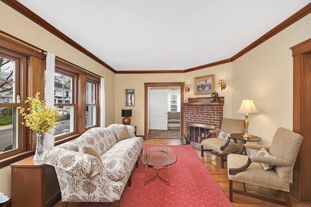 192 Maple Street Boston, MA 02132 - Photo 4 of 24 a living room with furniture and a large window
