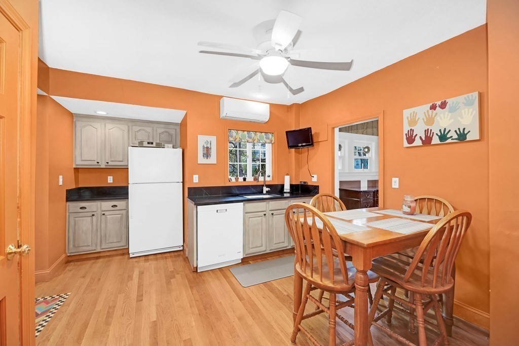 192 Maple Street Boston, MA 02132 - Photo 8 of 24 a view of a dining room with furniture and chandelier