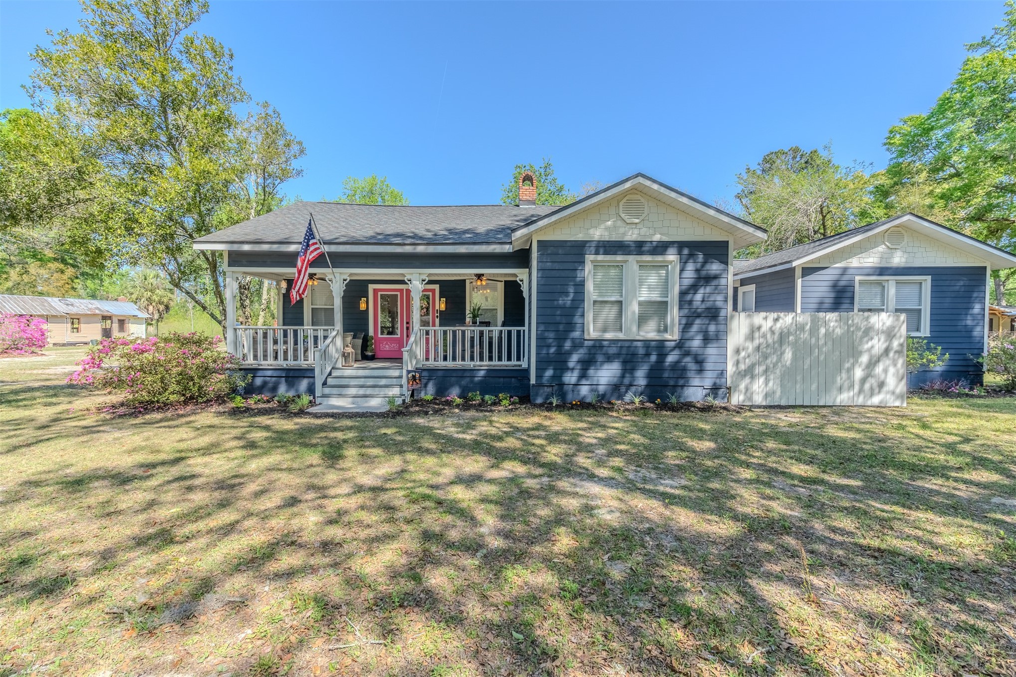 28180 Lake Hampton Road Hilliard, FL 32046 - Photo 1 of 34 a front view of a house with a yard and garage