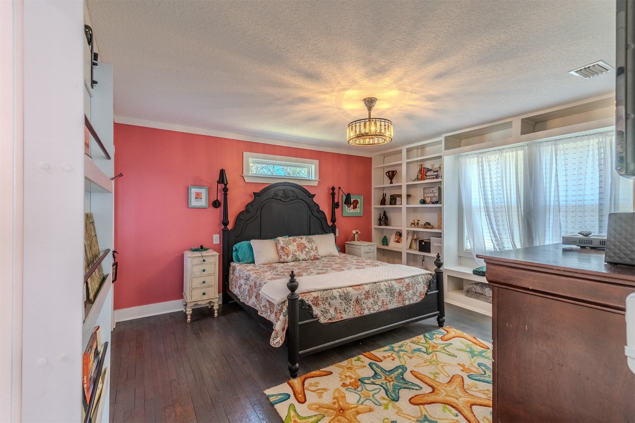 28180 Lake Hampton Road Hilliard, FL 32046 - Photo 16 of 34 a bedroom with a bed and a chandelier