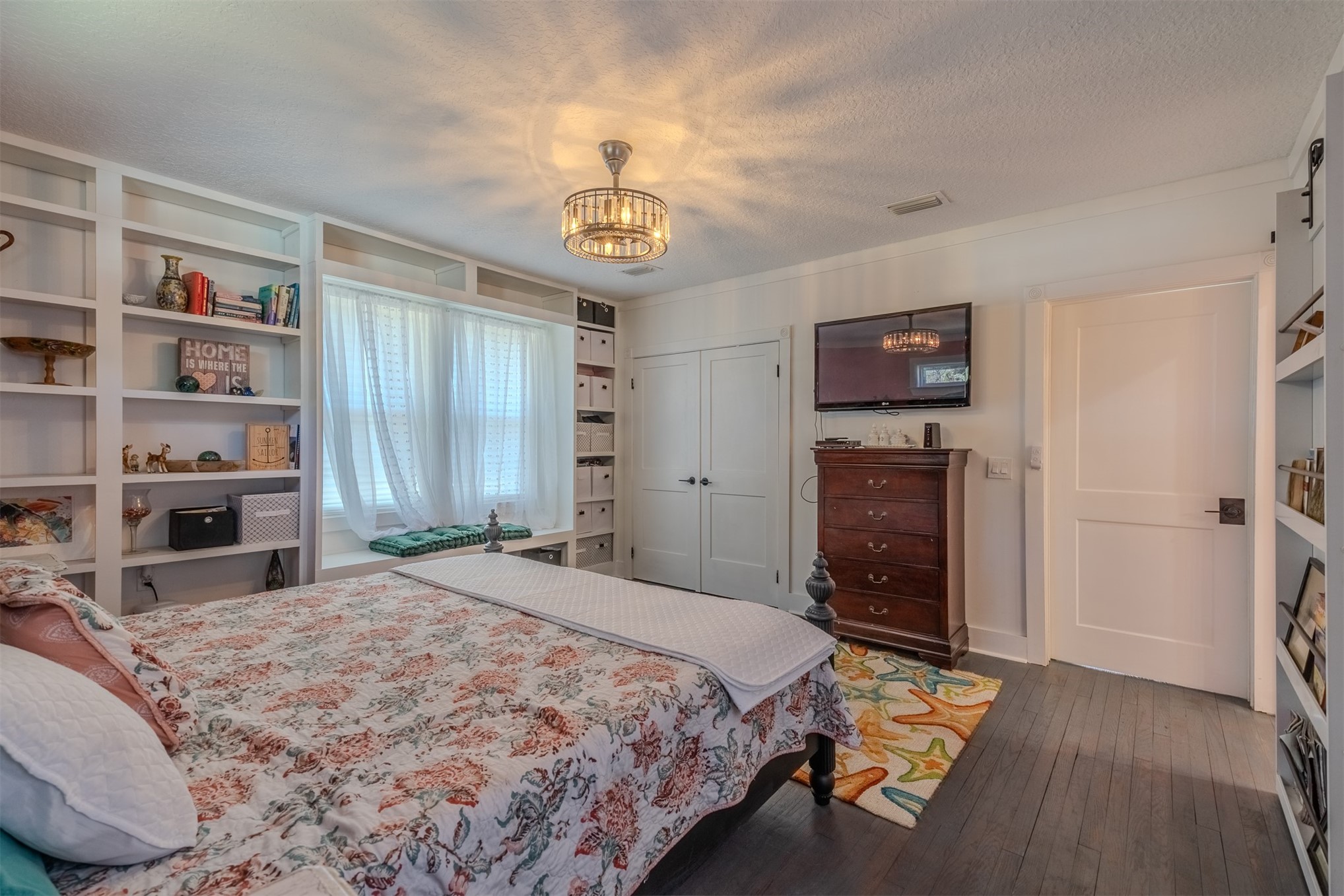 28180 Lake Hampton Road Hilliard, FL 32046 - Photo 18 of 34 a spacious bedroom with a bed and a flat screen tv