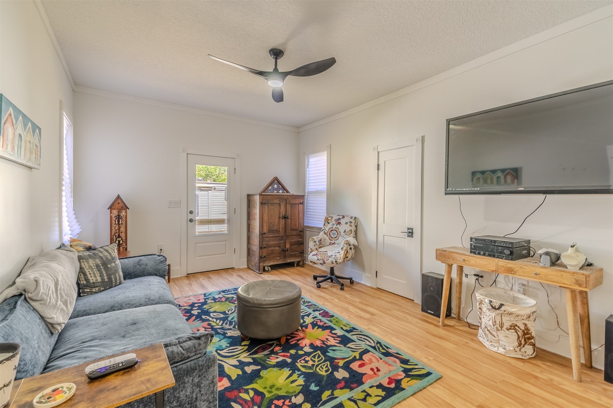 28180 Lake Hampton Road Hilliard, FL 32046 - Photo 24 of 34 a living room with furniture a rug and a chandelier