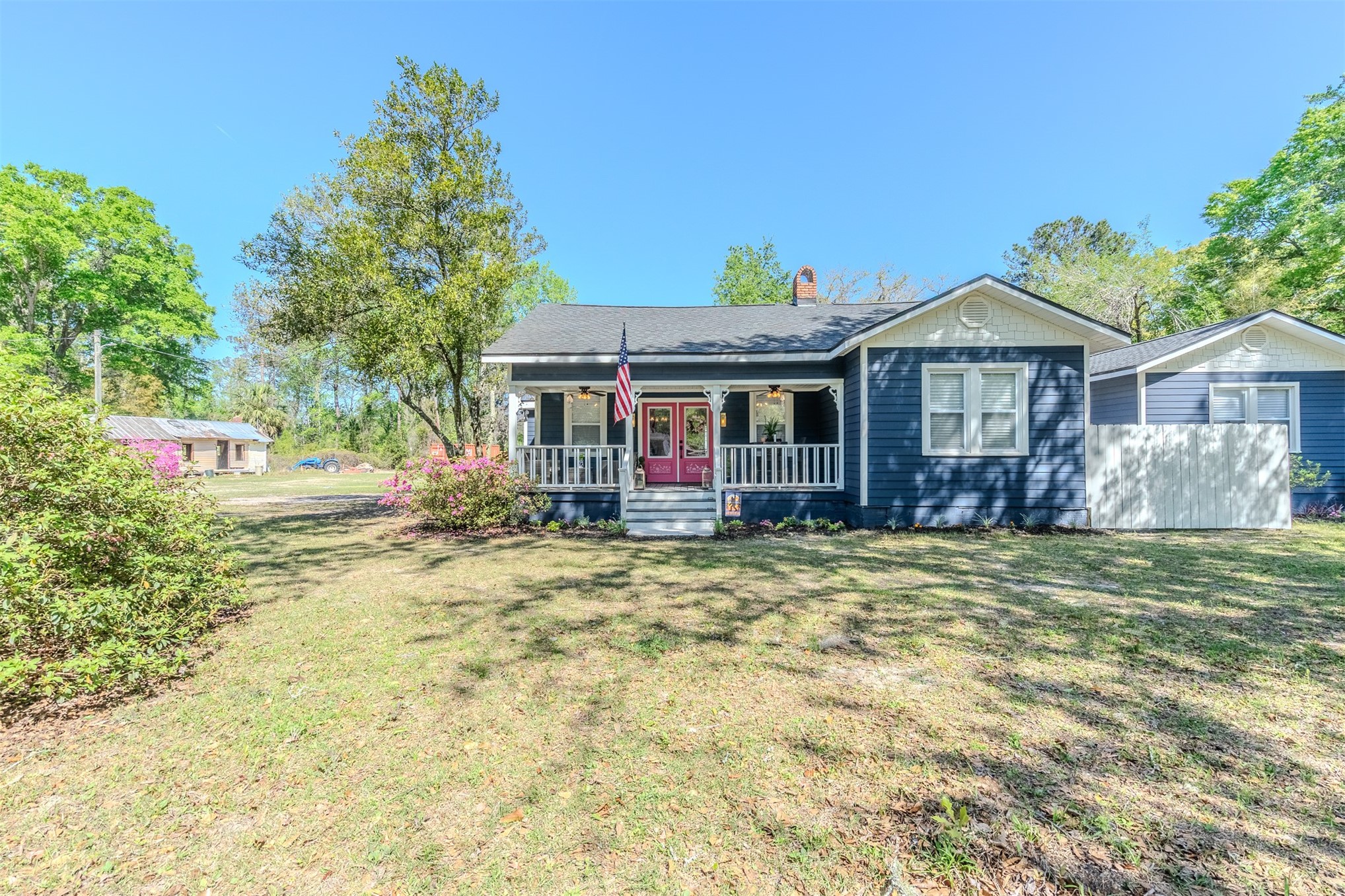 28180 Lake Hampton Road Hilliard, FL 32046 - Photo 3 of 34 a front view of a house with a yard