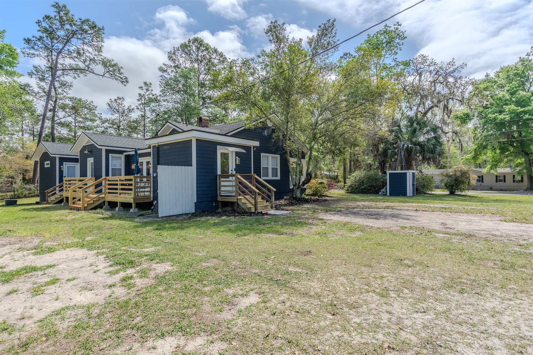 28180 Lake Hampton Road Hilliard, FL 32046 - Photo 32 of 34 a view of a house with backyard and trees