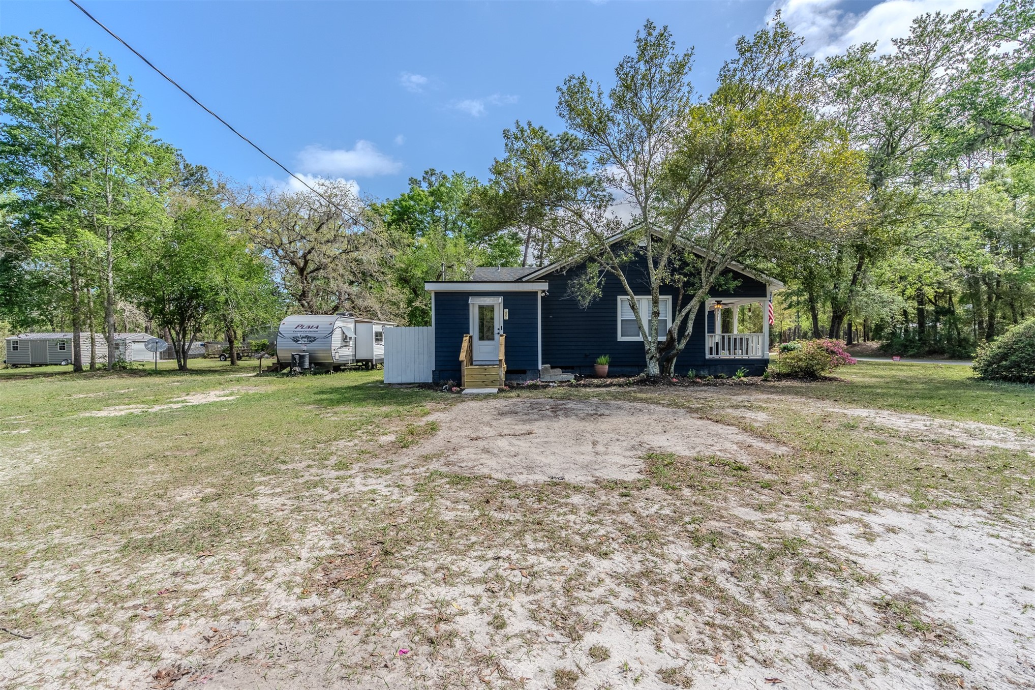 28180 Lake Hampton Road Hilliard, FL 32046 - Photo 33 of 34 a view of a house with backyard and trees