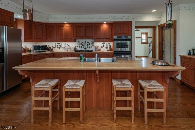 348 Rosemont Ringoes Road Stockton, NJ 08559 - Photo 17 of 42 a kitchen with a dining table and chairs